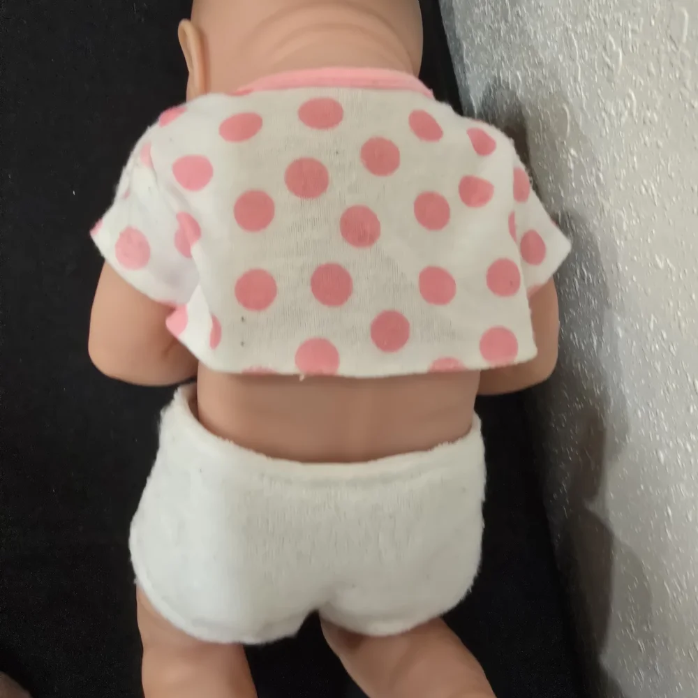 Adorable Baby Doll with Pink Polka Dot Outfit